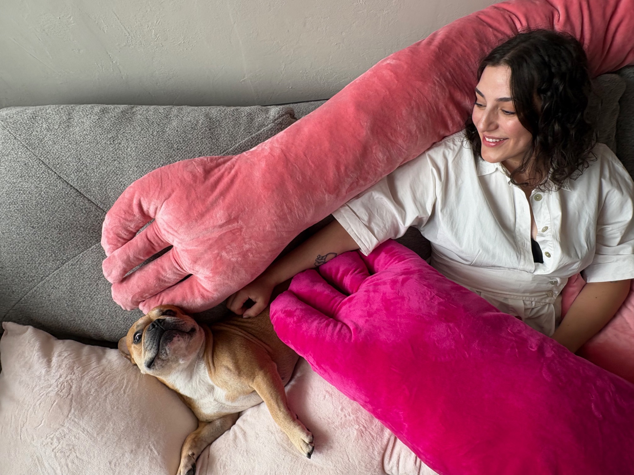 BIG HUG textile sculptures experienced at home with a woman and a dog