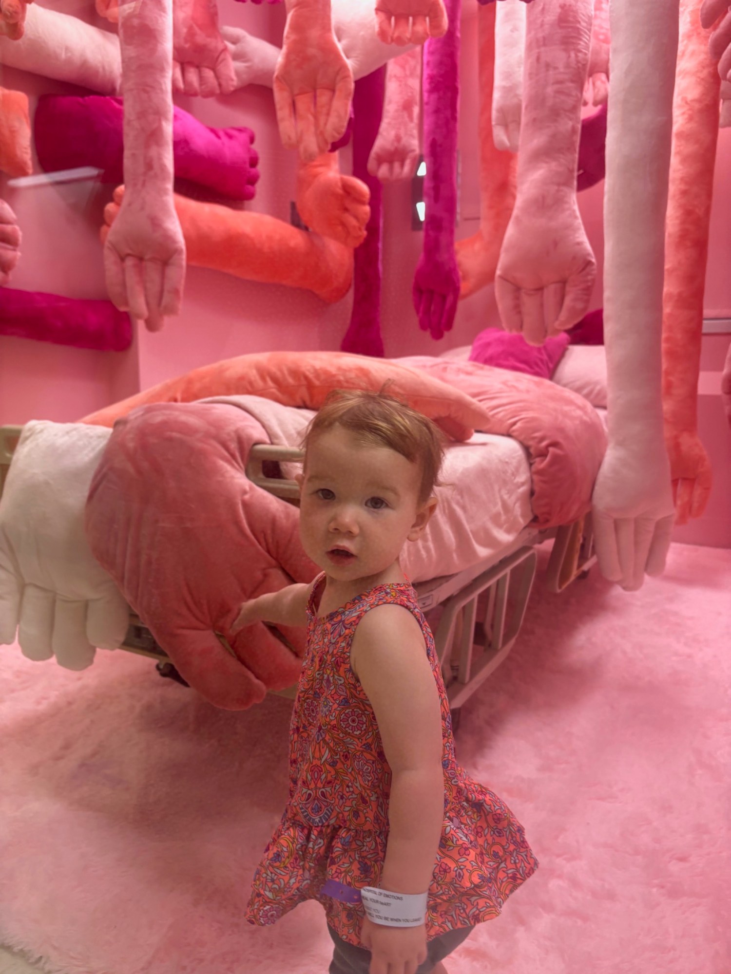 Child interacting with a BIG HUG textile sculpture