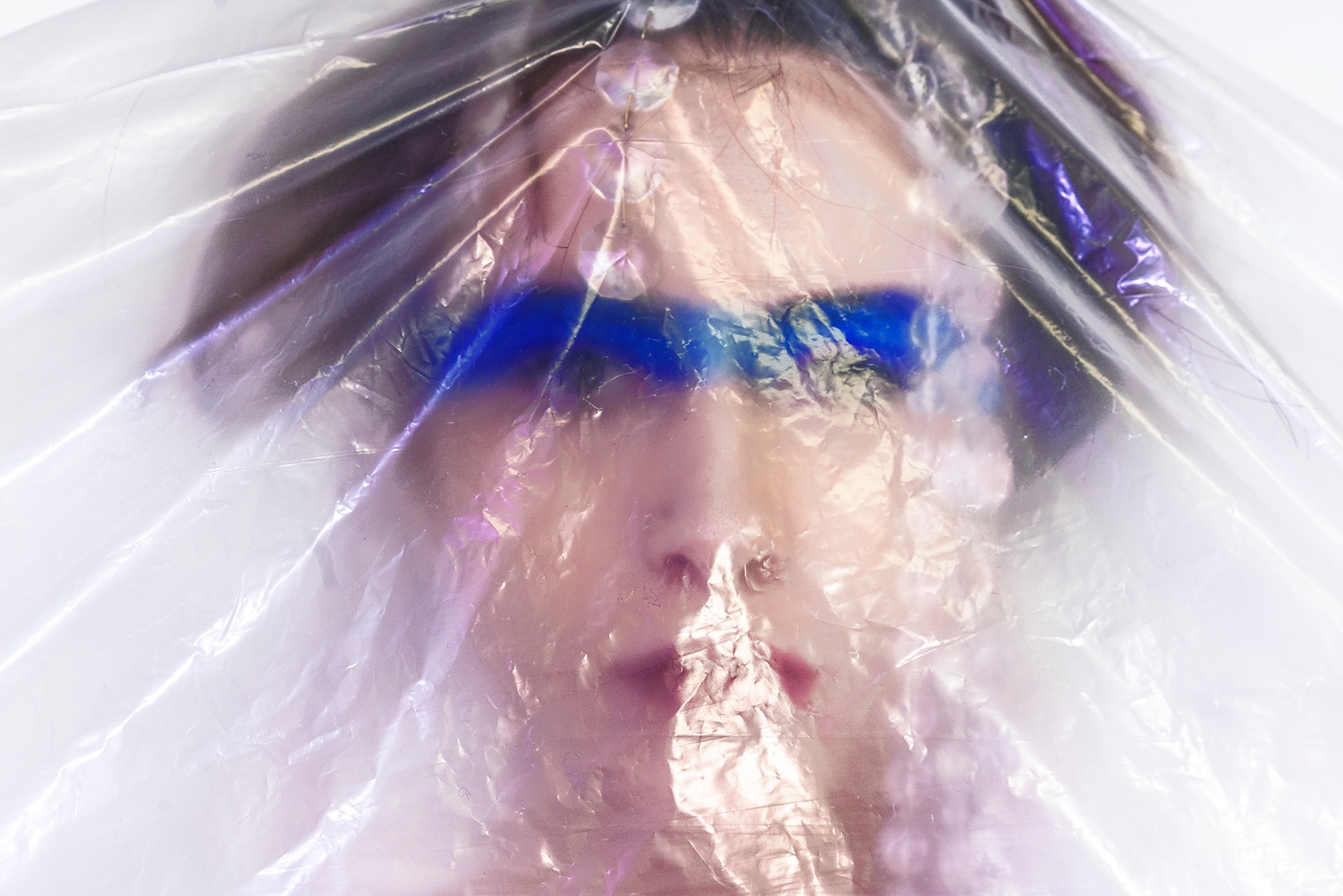 BLUE MADONNA close-up through translucent plastic