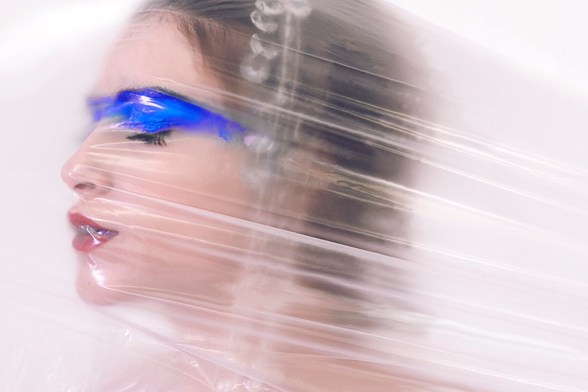 BLUE MADONNA profile through stretched plastic