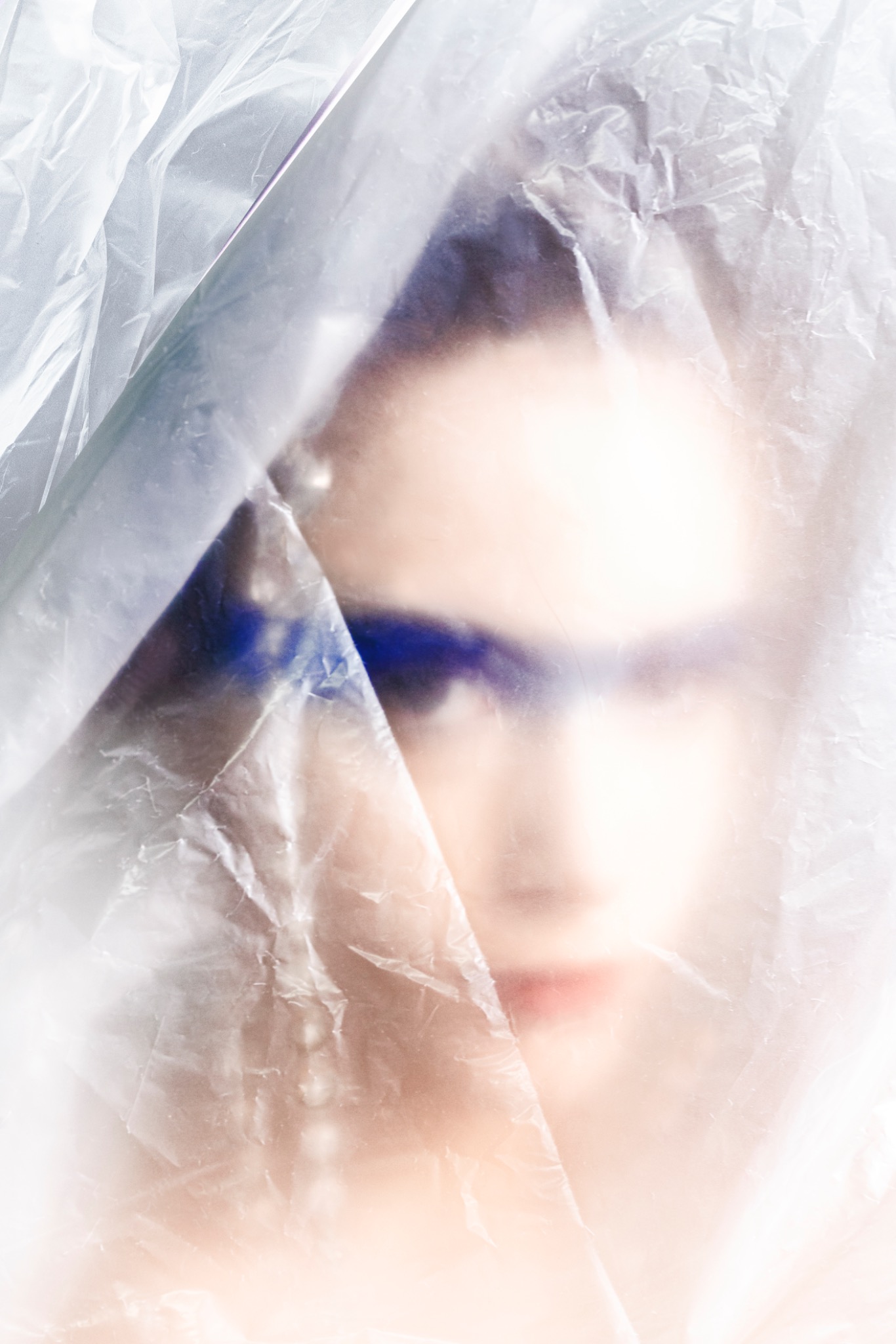 BLUE MADONNA face behind translucent material