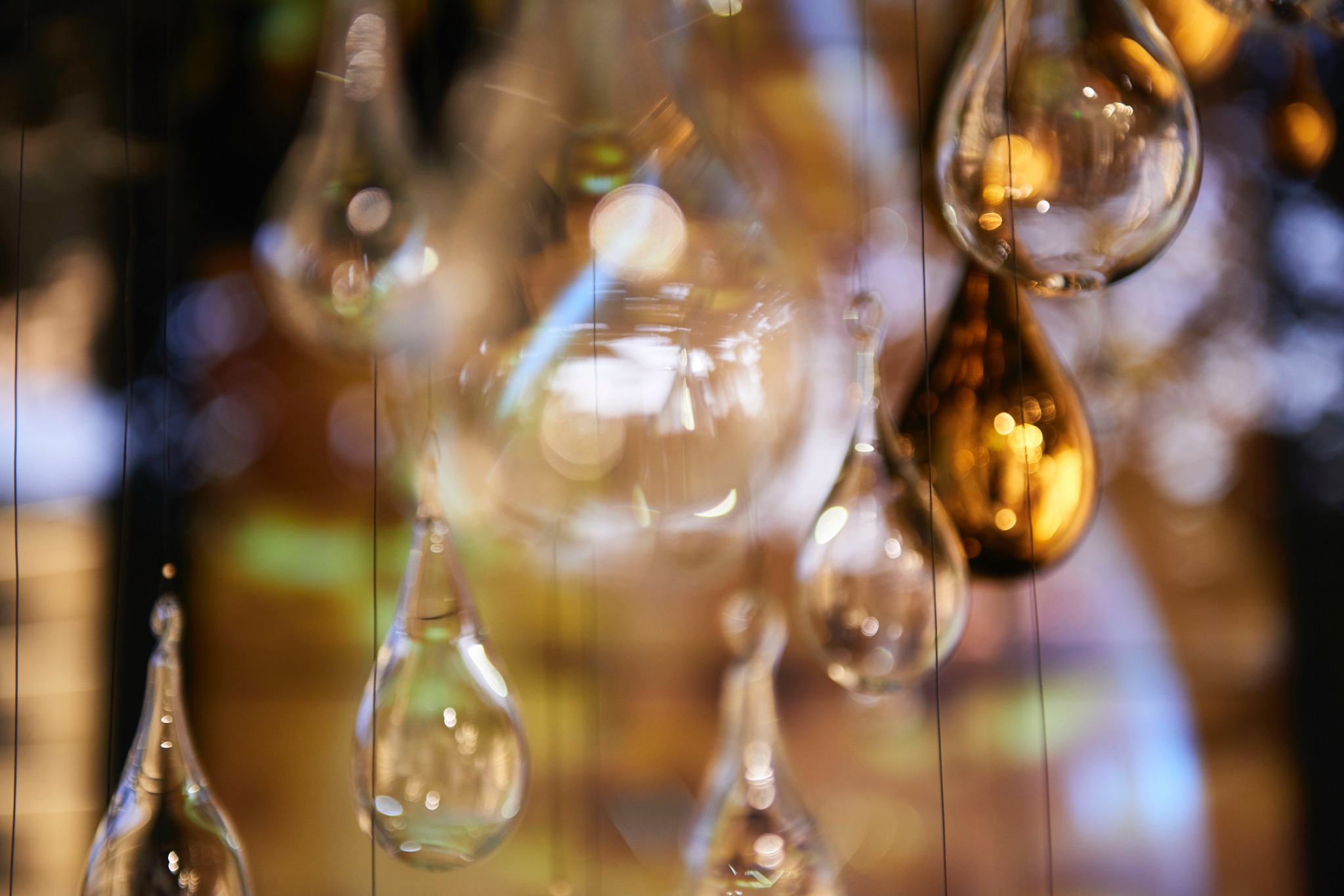 Close-up of suspended glass drops