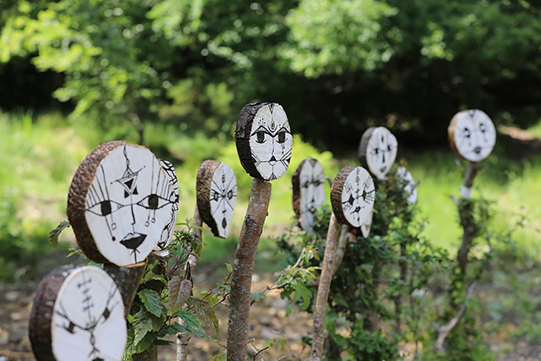 Forest spirits installed among living trees