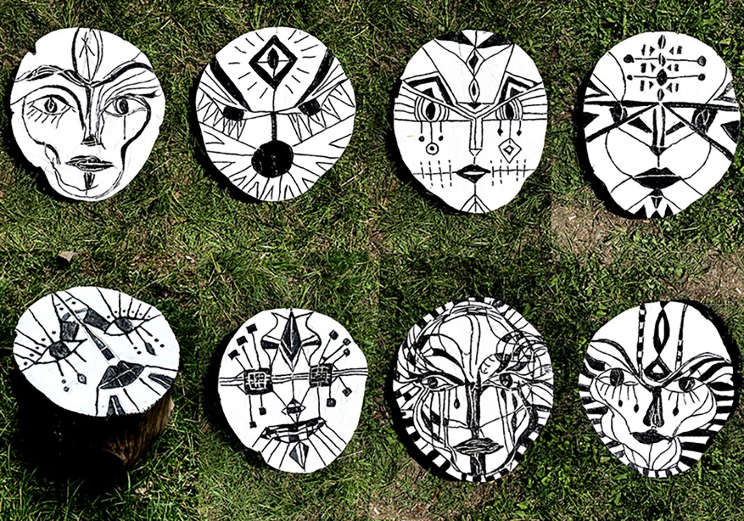 Group of painted forest faces