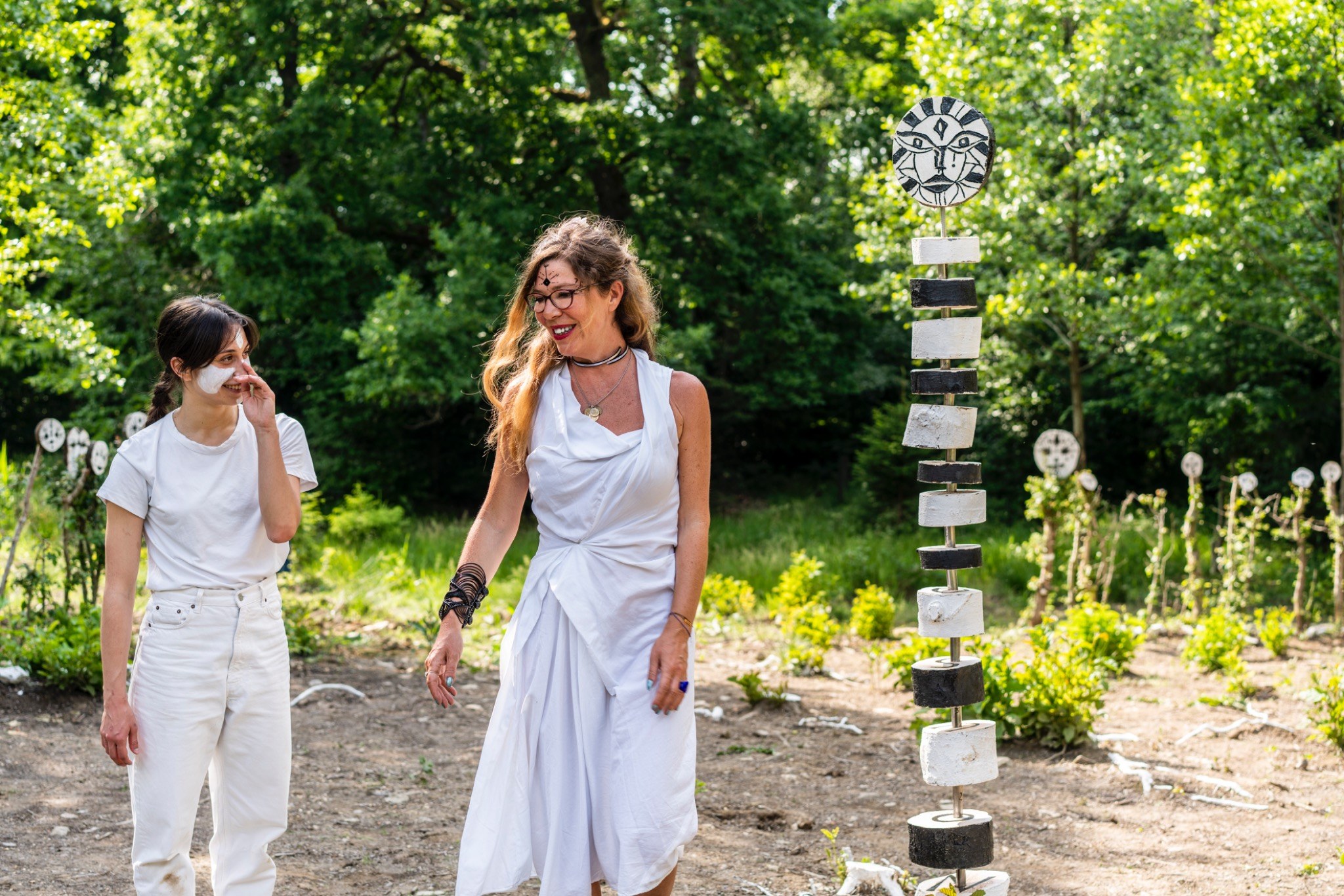 Performance and tall totem in the forest installation